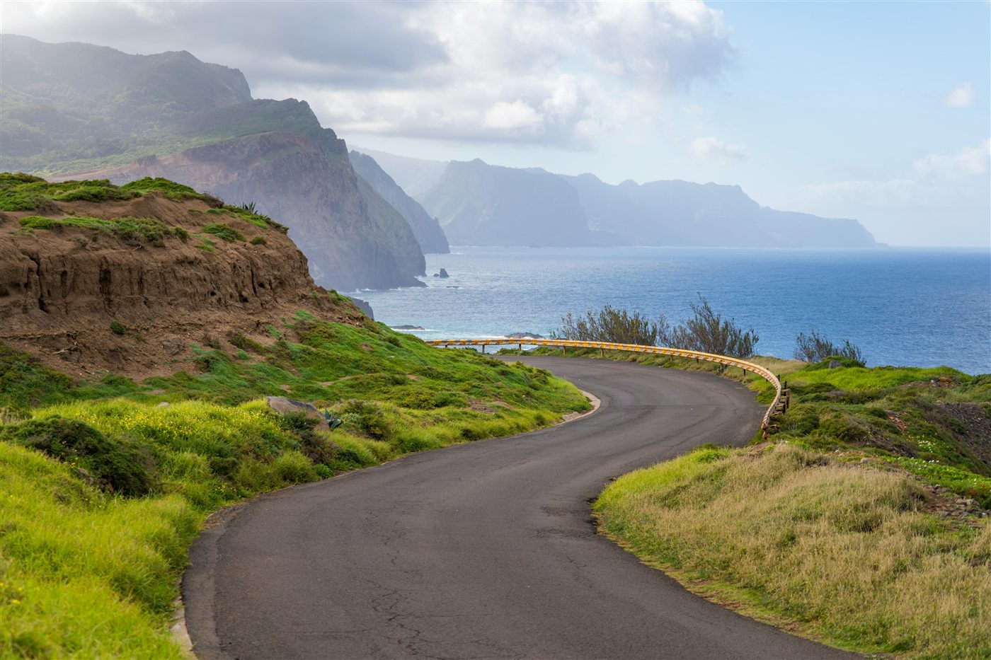 Winding coastal road overlooking the Atlantic in West Madeira